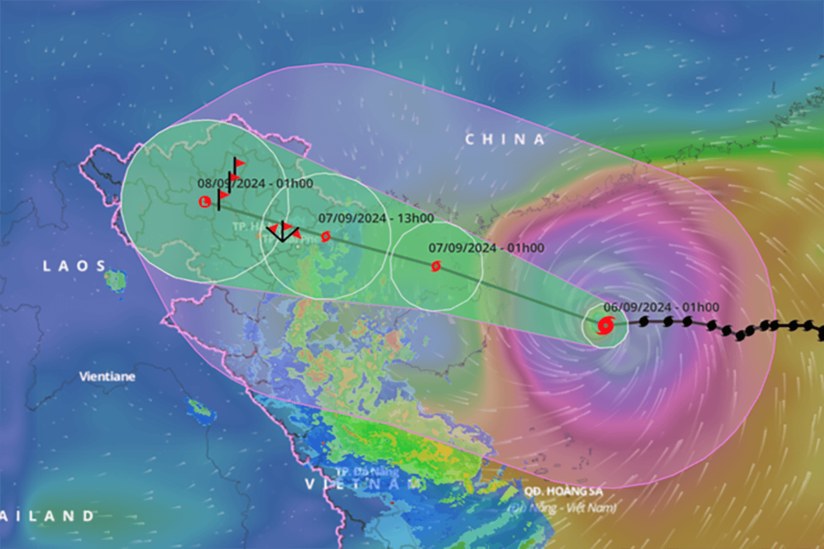 A 3D weather map showing a typhoon’s path across the East Sea, with Northern provinces highlighted and flood/landslide risk areas marked in color.