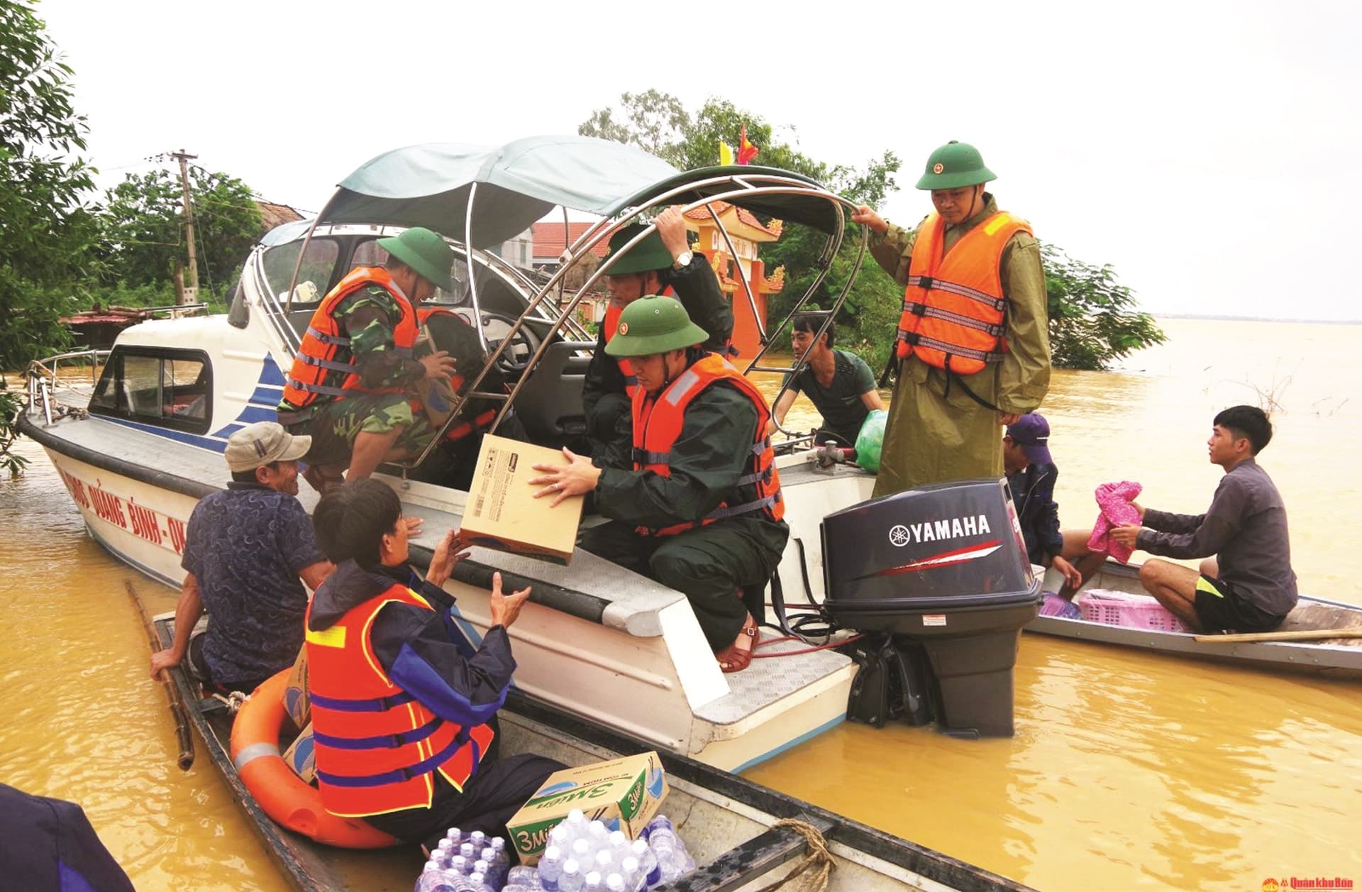 A group of villagers in Northern Vietnam repairing homes after a typhoon, supported by rescue teams and the Red Cross.